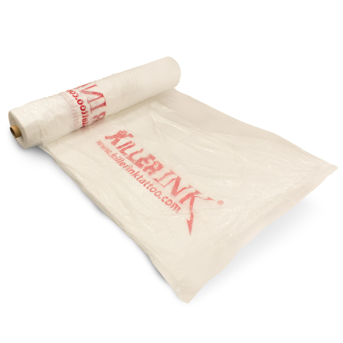 Roll of 250 Killer Ink Clingon chair covers with red logo on white plastic material.