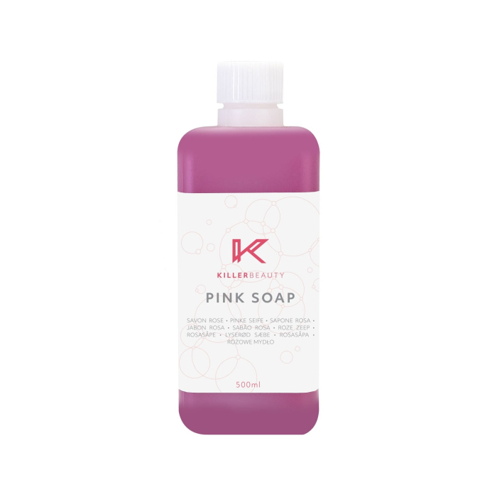 Flacon de 500 ml de savon concentré rose Killer Beauty, avec étiquette blanche et liquide rose, indiquant le nom du produit, le logo de la marque et des traductions multilingues.